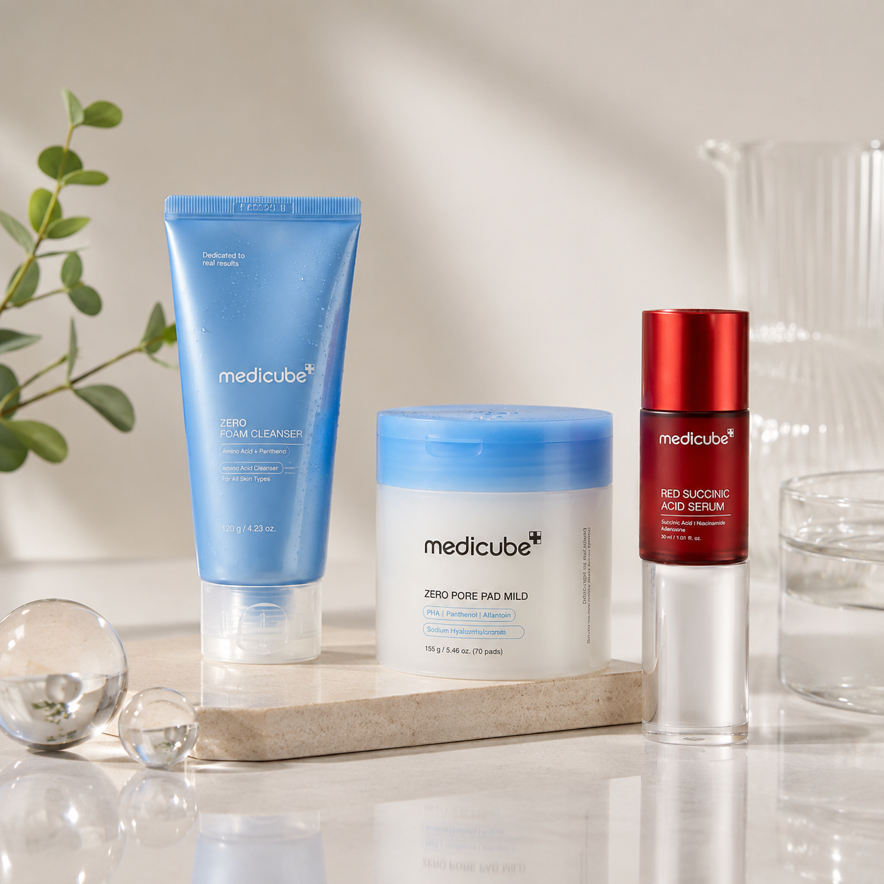 Medicube Glass Skin Starter Kit featuring Zero Foam Cleanser, Zero Pore Pad Mild, and Red Succinic Acid Serum in a premium Korean skincare display for a complete 3-step glass skin routine.
